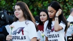 Students walk to class at Marjory Stoneman Douglas High School in Parkland, Fla., Feb. 28, 2018. Students returned to class for the first time since a former student opened fire there with an assault weapon. (AP Photo/Terry Renna)