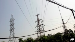 FILE - Power lines are seen in Ninh Binh Power Plant, which is a coal fired power plant to supply electricity, in Ninh Binh Province in Vietnam, Sept. 19, 2007.
