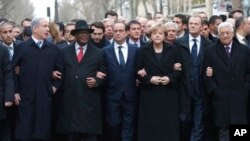 From the left, Israeli Prime Minister Benjamin Netanyahu, Malian President Ibrahim Boubacar Keita, French President Francois Hollande, German Chancellor Angela Merkel, EU president Donald Tusk and Palestinian Authority President Mahmoud Abbas march during a rally in Paris, France, Jan. 11, 2015.