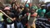 Miners from Marikana, along with their families and supporters, march to the Union Buildings in Pretoria, to protest the government's lack of legal funding for the Marikana commission of inquiry, Sept. 12, 2013.
