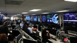 FILE - U.S. Department of Homeland Security election security workers monitor screens in Arlington, Virginia, Nov. 6, 2018.