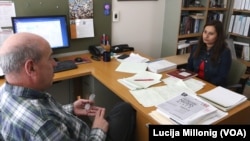 University of New Mexico international student Anima Bista talks with one of her civil engineering professors.