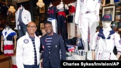 FILE - Olympic medalists Peter Westbrook, left, and Daryl Homer model the Team USA Tokyo Olympics opening ceremony uniforms at the Ralph Lauren SoHo store, July 7, 2021, in New York. 