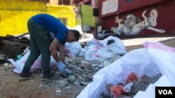 Ayad Nasser has also paid for the neighbourhood to be cleaned up. (J. Owens for VOA)