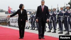 Taiwan's President Tsai Ing-wen and Paraguay's President Mario Abdo Benitez review honor guards at a welcoming ceremony, in Taipei, Taiwan, Oct. 8, 2018. Paraguay is one of Taiwan's few remaining allies.