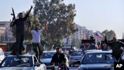 شماری از قوای حامی رئیس جمهور سوریه در دمشق شعار های ضد امریکا، برتیانیا و فرانسه سر دادند