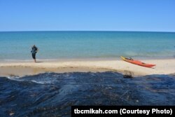 Sandy beaches are just one of the unique and diverse features at Pictured Rocks National Lakeshore in Michigan. While the water may look warm and inviting, it is extremely cold.