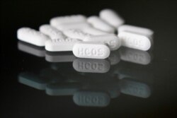 FILE - This April 6, 2020, photo shows an arrangement of hydroxychloroquine pills in Las Vegas.