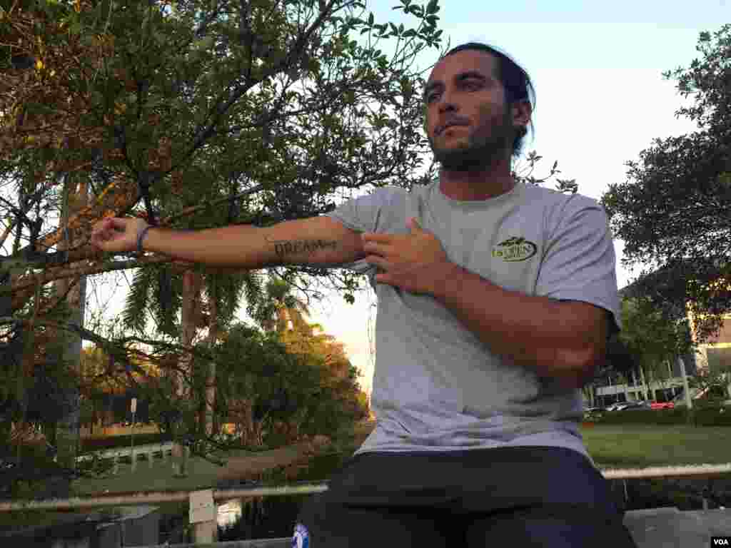 Adrian Escarate, 27, seen in Florida on March 14, 2016, has the word "Dreamer" tattooed on his arm. He is a recipient of deferred action and is concerned about what the upcoming elections can mean for the executive measure introduced by President Barack O