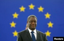 Congolese gynecologist Denis Mukwege attends an award ceremony to receive his 2014 Sakharov Prize at the European Parliament in Strasbourg, Nov. 26, 2014. On Friday Mukwege won the Nobel Peace Prize with Nadia Murad.