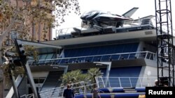 People walk by the Avengers Headquarters ahead of the opening of the Avengers Campus area at Disney California Adventure Park in Anaheim, California, U.S., June 1, 2021. Picture taken June 1, 2021. 