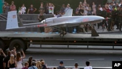 A Turkish-made Bayraktar TB2 drone is displayed during a rehearsal of a military parade dedicated to Independence Day in Kyiv, Ukraine, Aug. 20, 2021. (AP Photo/Efrem Lukatsky, File)