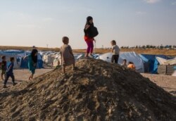 Even little girls where veils for modesty at this camp for foreign wives and children of IS fighters, pictured on Sept. 1, 2019 in Ain Issa Camp, Syria. (VOA/Yan Boechat)