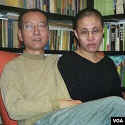 Pembangkang Tiongkok penerima Nobel Perdamaian, Liu Xiaobo bersama isterinya, Liu Xia.