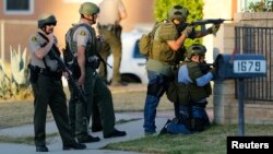 Police conduct a manhunt after at least two assailants opened fire at a holiday party in San Bernardino, California December 2, 2015.