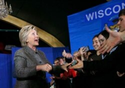 FILE - Democratic presidential candidate Hillary Clinton greets attendees before speaking at the Riverside Ballroom in Green Bay, Wis., March 29, 2016.