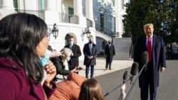 U.S. President Donald Trump speaks to the press as he departs the White House on travel to visit the U.S.-Mexico border Wall in Texas, in Washington, U.S., January 12, 2021. REUTERS/Kevin Lamarque