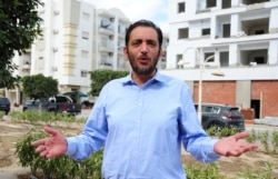 FILE - Yassine Ayari reacts during an interview in Tunis, Tunisia, Oct.12, 2021.