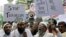FILE - Indian Muslims shout slogans against terrorism during the protest against a September 7 blast outside a courthouse in New Delhi, in Mumbai, India, September 2011.