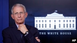 FILE - Anthony Fauci, director of the National Institute of Allergy and Infectious Diseases, is seen at the White House, in Washington, April 1, 2020. The National Bobblehead Hall of Fame and Museum is creating a bobblehead of Fauci.