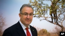 FILE - Rotterdam Mayor Ahmed Aboutaleb poses during a meeting with other mayors to push for local actions to fight climate change on the margins of the United Nations Climate Change Conference, in Paris, Dec. 3, 2015.