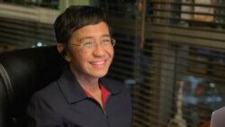 In this photo provided by the Rappler, Rappler CEO and Executive Editor Maria Ressa reacts after hearing she won the Nobel Peace Prize, inside her home in Taguig, Metro Manila, Philippines, Oct. 8, 2021.