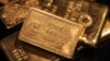 FILE - Gold bars are displayed at a gold jewelry shop in the northern Indian city of Chandigarh. 