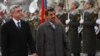 Armenian President Serzh Sargsyan (L) walks with Iran's President Mahmoud Ahmadinejad (C) during an official welcoming ceremony in Yerevan, Dec. 23, 2011. 