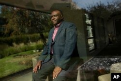 FILE - Former Congolese Vice President Jean-Pierre Bemba poses for a photograph after being interviewed by The Associated Press in Waterloo, Belgium, Sept. 11, 2018.