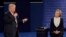 Republican presidential nominee Donald Trump speaks to Democratic presidential nominee Hillary Clinton during the second presidential debate at Washington University in St. Louis, Sunday, Oct. 9, 2016. 