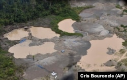 Aerial view over an area deforested by illegal gold mining in the Madre de Dios province of Peru, Tuesday, Feb. 19, 2019