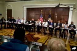 President Barack Obama speaks to the media at the bottom of a meeting at the Eisenhower Executive Office Building on the White House complex in Washington, July 13, 2016.