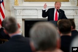 President Donald Trump speaks during a meeting with the members of the National Governors Association in the State Dining Room of the White House, Feb. 26, 2018.