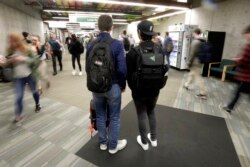 In this November 14, 2019, photo, students walk on the campus of Utah Valley University, in Orem, Utah.