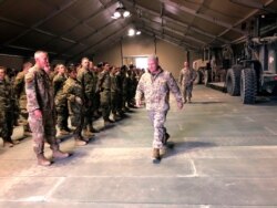 FILE - Marine Gen. Frank McKenzie meets with troops at Prince Sultan Air Base in Saudi Arabia, Jan. 29, 2019.