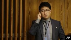 FILE - Kim Ju Song, a member of the North Korean delegation, listens to a panel discussion about human rights abuses in North Korea at U.N. headquarters in New York, Oct. 22, 2014.