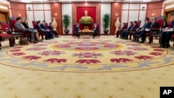 FILE - U.S. Secretary of State Antony Blinken, center left, meets with Vietnam's Communist Party General Secretary Nguyen Phu Trong, center right, at Communist Party of Vietnam Headquarters in Hanoi, Vietnam, April 15, 2023.
