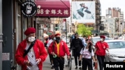 Wally Ng, a member of the Guardian Angels, patrols with other members in Chinatown during the outbreak of the coronavirus disease (COVID-19) in New York City, New York, U.S., May 16, 2020.