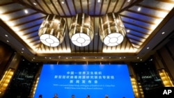  In this Feb. 9, 2021, file photo, a WHO-China Joint Study Press Conference is held at the end of a WHO mission to investigate the origins of the coronavirus pandemic in Wuhan in central China's Hubei province. 