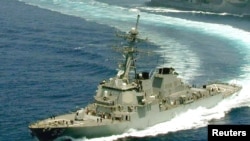 FILE - The Arleigh Burke class destroyer USS Russell is shown in the Gulf of Oman.