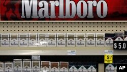 FILE - In this July 17, 2013 file photo, Marlboro cigarettes are on display in a CVS store in Pittsburgh. CVS, the second largest drug store chain in the U.S., has stopped selling tobacco products.