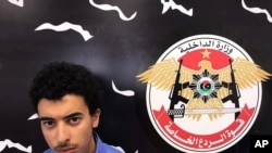 In this Wednesday, May 24, 2017 photo, Hashim Ramadan Abedi appears inside the Tripoli-based Special Deterrent anti-terrorism force unit after his arrest on Tuesday for alleged links to the Islamic State extremist group. Abedi is the brother of Salman Abedi, the Manchester suicide bomber suspected.