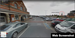 Street view from the exit of Salisbury's train station. The spire of the famous cathedral is visible from this location.