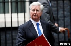FILE - Britain's Minister of Defense Michael Fallon