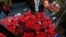 FILE - An employee organizes bouquets of flowers to be exported overseas, ahead of Valentine's Day, at Discovery Farm in Facatativa, Colombia, Feb. 8, 2018.