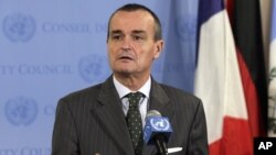 France's U.N. Ambassador Gerard Araud, the current Security Council president, answers reporters' questions at the United Nations after a closed meeting of the Security Council on Syria, August 16, 2012. 