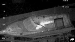 Nineteen-year-old Boston Marathon bombing suspect, Dzhokhar Tsarnaev, shown hiding inside a boat during a search for him in Watertown, Massachusetts, April 19, 2013.