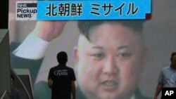 A TV news shows an image of North Korean leader Kim Jong Un while reporting North Korea's missile test which landed in the waters of Japan's economic zone in Tokyo, July 4, 2017. (AP Photo/Eugene Hoshiko)