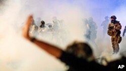Federal officers use chemical irritants and projectiles to disperse Black Lives Matter protesters at the Mark O. Hatfield United States Courthouse in Portland, Oregon, July 24, 2020.