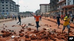 Supporters of a Guinea opposition party clash with police as they protest against president Alpha Conde on May 10, 2012 in Conakry.